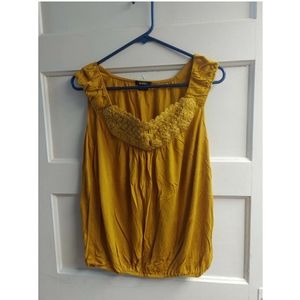 Yellow sleeveless blouse